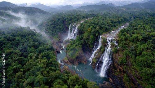 Lush green valley with cascading waterfalls