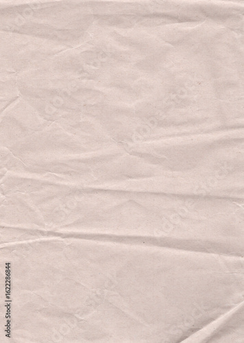 ベージュ色の皺のあるざらざらした紙