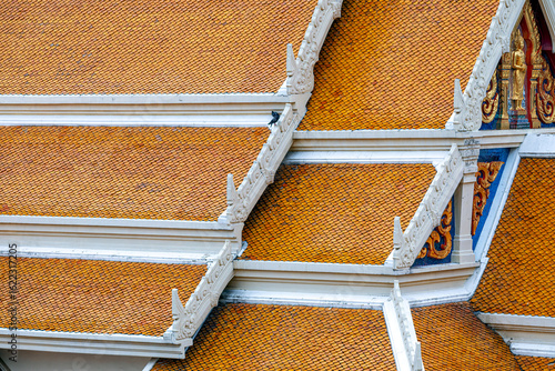 Photography Orange tiled roofs of the Wat Traimit temple complex or Temple of the Golden Bud