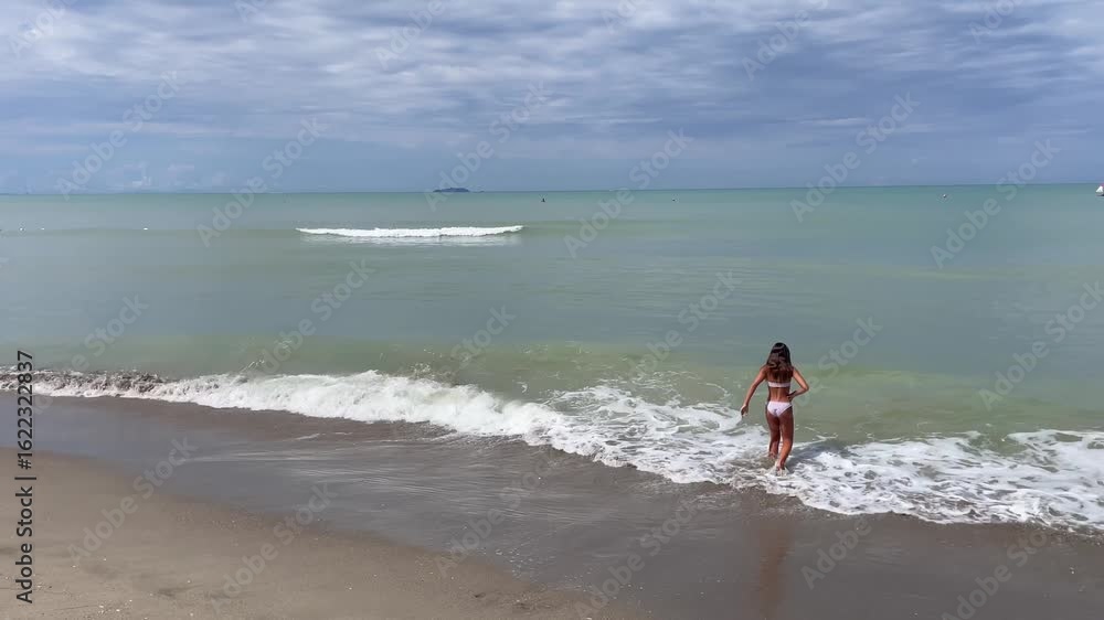 Girl walking on the ocean Girl walking on the ocean