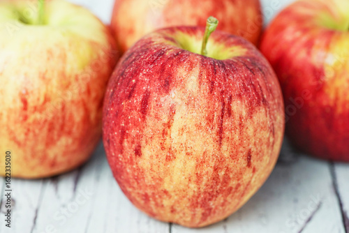 Close up of fresh red apple with water drops.