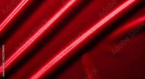 Luxurious Red Fabric with Diagonal Folds and Subtle Highlights