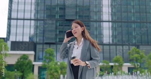 Smiling Businesswoman Talking on the Phone Outdoors