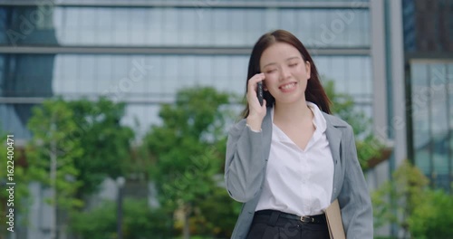 Smiling Businesswoman Talking on the Phone Outdoors