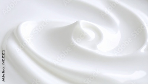 Close-up of glossy white yogurt with soft swirls and peaks