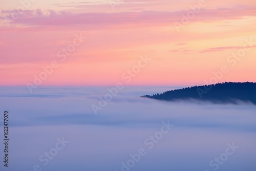 Wallpaper Mural Misty mountain peak at sunrise with pink and orange sky Torontodigital.ca
