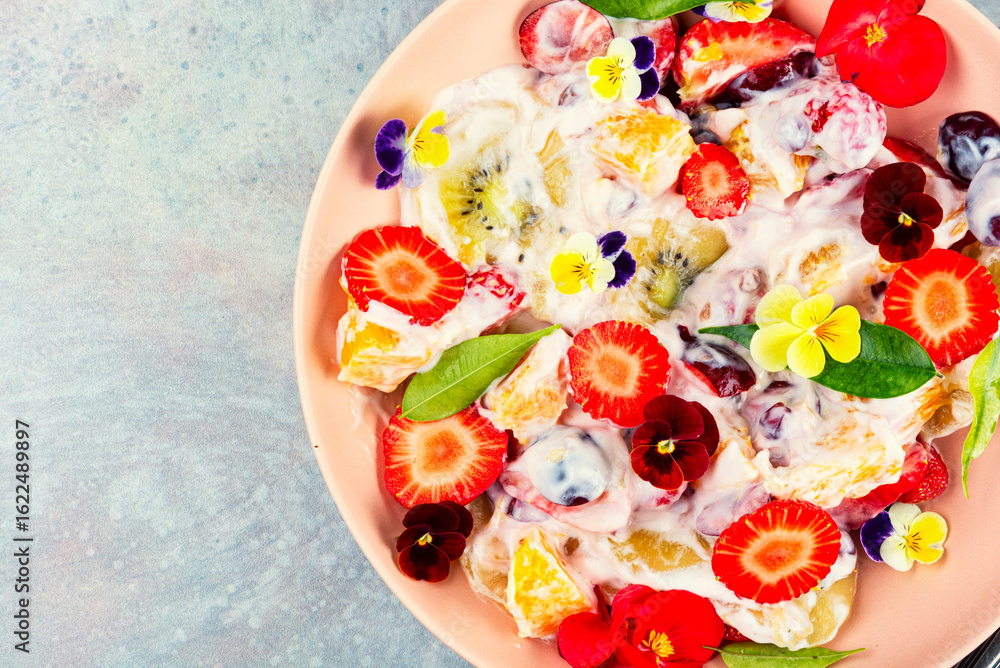 Obraz premium Summer flowers fruit salad.