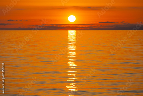 Bright orange sunset with full sun