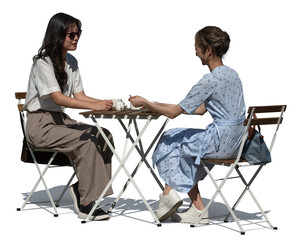 Two Asian women sitting in an outdoor cafe and talking, isolated on transparent and white background