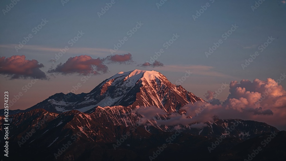 Fototapeta premium Sun Rises Beyond the Ridge Seen from a High Vantage