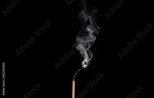 Wooden Matches on fire and smoke on black