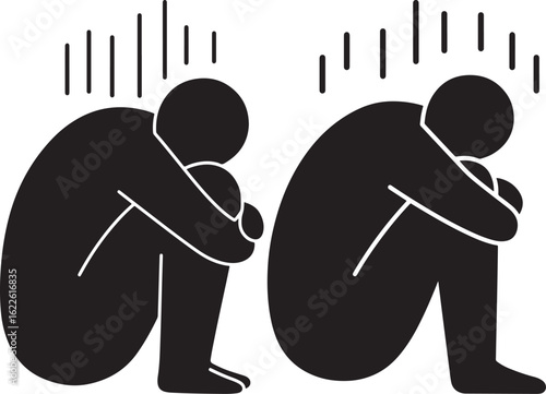 Two figures huddled in despair silhouette