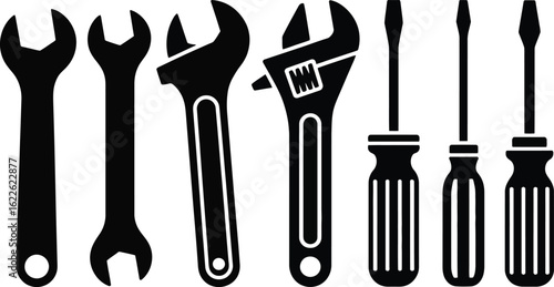 Collection of silhouetted wrenches and screwdrivers on white background