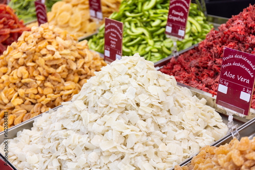 Selection of dried fruits like aloe vera, apple and other offered at a market stall