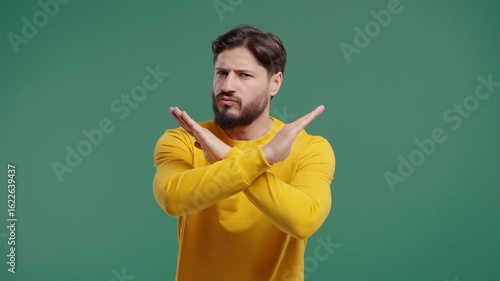 Dissatisfied bearded man disapproving With No Sign, Refuse Offer. Rejecting