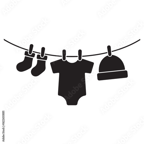 Black silhouette of baby clothes including socks onesie and hat hanging on a clothesline
