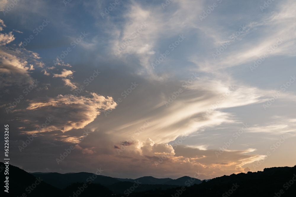 Sunset painting the sky with warm hues over the euganean hills Sunset painting the sky with warm hues over the euganean hills