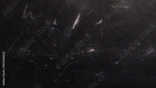 Vintage grunge texture with dust and scratches on black background. Black dirty dust and scratches overlay. Old film effect with scratched texture. Old photo overlay texture. Copy space.