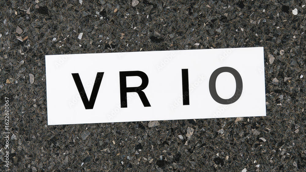 Business model illustration with a VRIO abbreviation card emphasizing Value, Rarity, Inimitability, and Organization in a professional office setting Business model illustration with a VRIO abbreviation card emphasizing Value, Rarity, Inimitability, and Organization in a professional office setting
