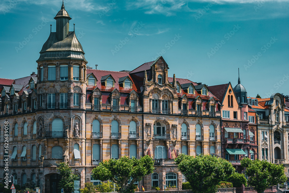 Obraz premium Panoramic view of beautifully preserved Art Nouveau and historic buildings along the Rhine River in Konstanz Germany. The colorful facades and ornate architecture create a charming cityscape on a brig