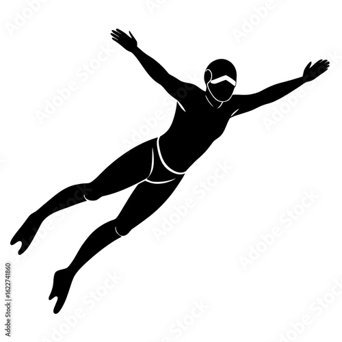 Black silhouette of a free diver swimming underwater