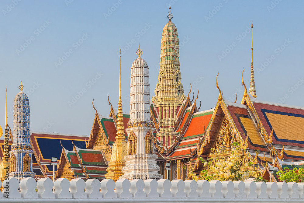 Naklejka premium Beautiful of Buddhist temple or Wat Phra Kaew or Wat Phra Si Rattana Satsadaram with famous tourist landmark sunlight in the morning, Bangkok, Thailand.