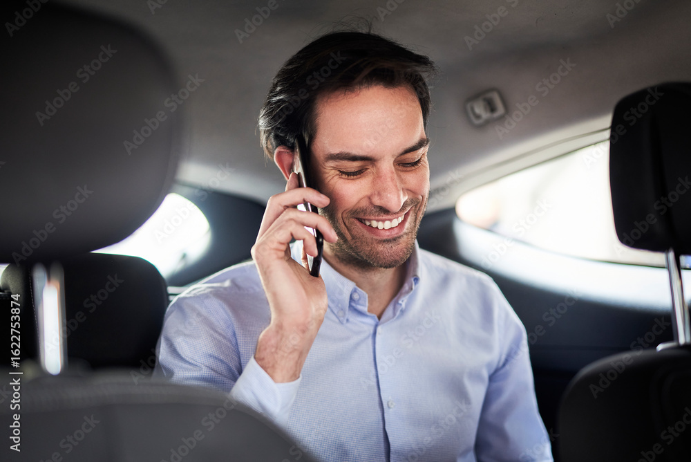Young business man talking on his phone in the taxi Young business man talking on his phone in the taxi