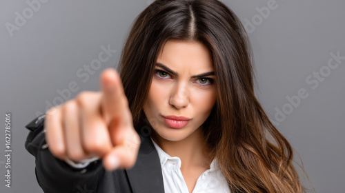 Wallpaper Mural Angry woman pointing finger forward with serious expression Torontodigital.ca