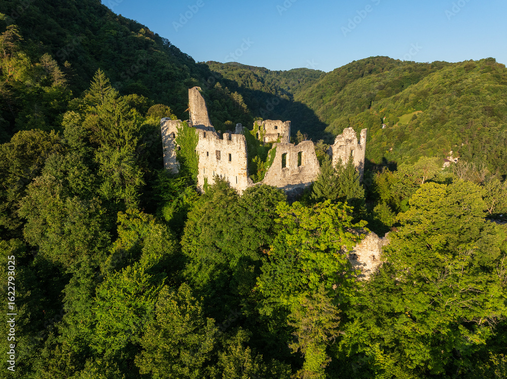 Obraz premium Aerial View of Ruins of an Old Fortress in the Forested Hills near Samobor, Croatia