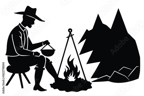 Silhouette of Man Cooking over Campfire with Mountain Backdrop Depicting Outdoor Adventure and Simple Living