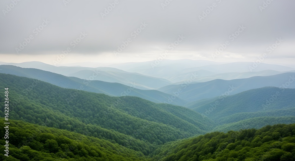 Fototapeta premium Landscape view of green mountains under a cloudy sky in daytime