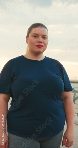 Outdoor Portrait of Body Positive Overweight Woman Doing Jogging Fitness Training Outdoors at City in the Morning, Healthy Lifestyle Concept