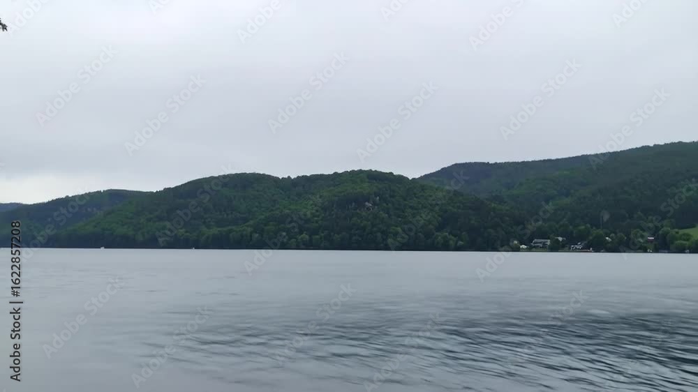 Lake scenery under cloudy sky Lake scenery under cloudy sky