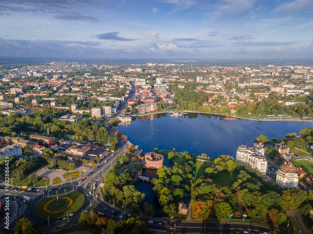 Fototapeta premium Aerial panorama of Kaliningrad, western Russia, featuring the Upper Pond, lush parks, historic and modern Baltic architecture. 