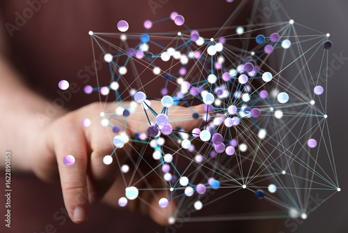 Abstract image of a hand interacting with a complex network of interconnected nodes. Represents global communication, data, technology, or AI.
