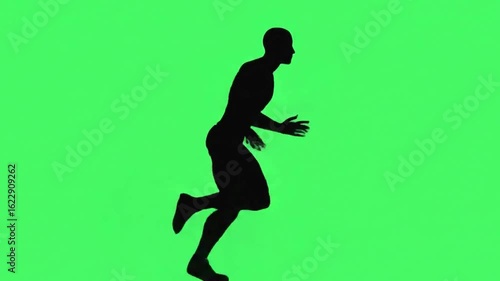 Silhouette of a man running at full speed against a green background representing fitness and a healthy lifestyle 4k video