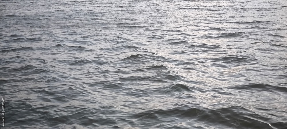 Water waves and evening light for background Water waves and evening light for background