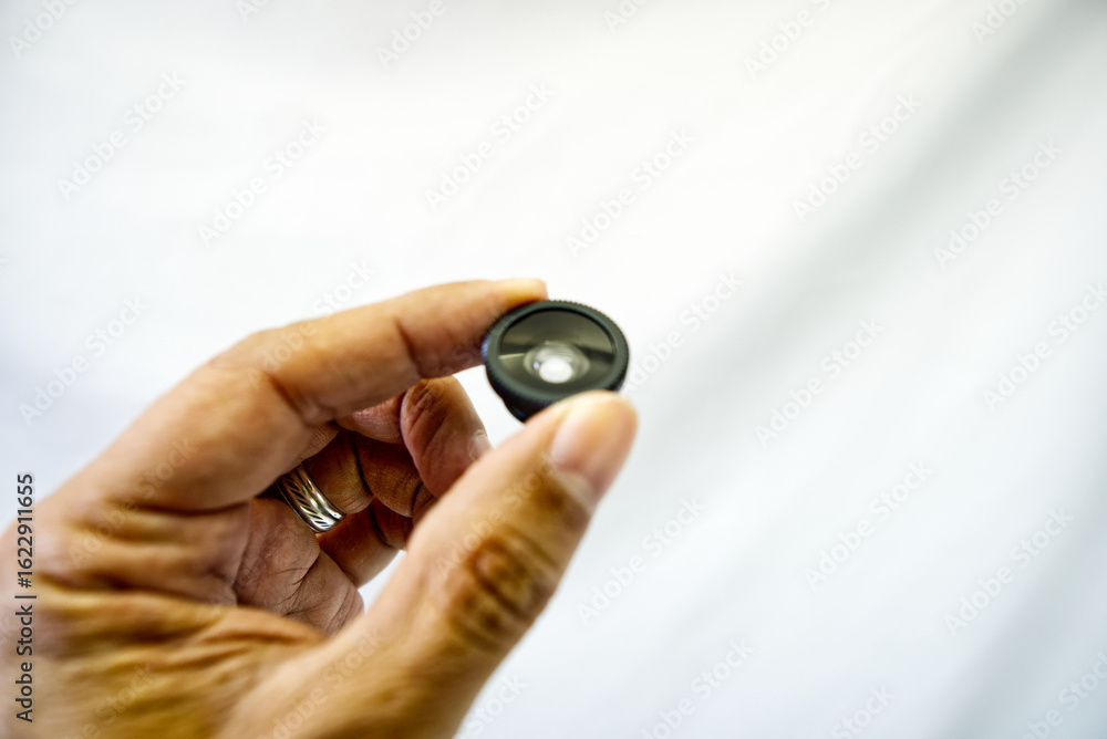 Fototapeta premium Small cell phone lenses to see bigger