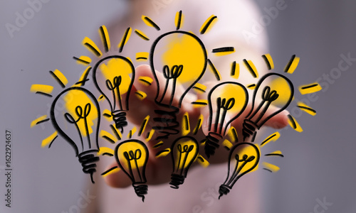 Hand drawn lightbulbs repre...