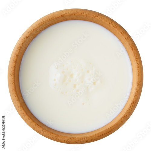airag (fermented mare's milk) in wooden bowl, top down ,isolated on white background