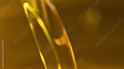 Golden liquid pouring slow motion abstract background viscous fluid flow rich texture shimmering light, liquid, pouring, slow motion, abstract, background, viscous, fluid, flow, rich, texture, shimmer