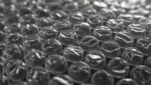 Close-up view of bubble wrap texture showcasing its glossy surface and unique patterns, ideal for packaging