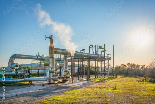 Geothermal energy. Pipelines of a plant in Larderello, Tuscany region, Italy