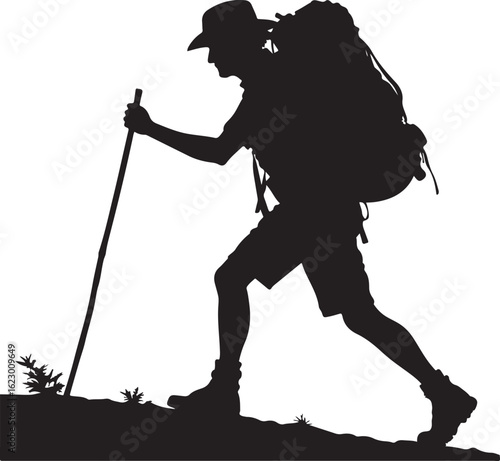 Silhouette of a hiker ascending a mountain trail