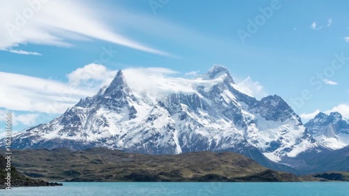 Wallpaper Mural Snowcapped mountain peaks under a blue sky with clouds reflecting in lake Torontodigital.ca