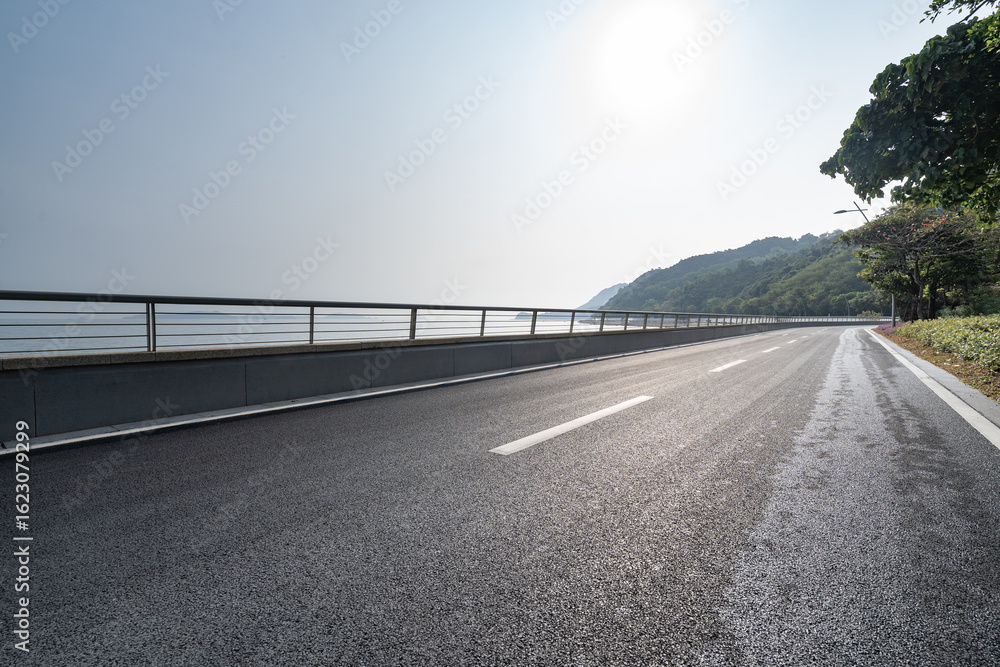 Fototapeta premium asphalt road side by sea