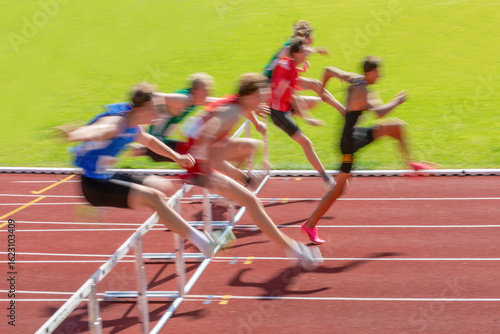 hurdle competition in a decathlon in blurred vision