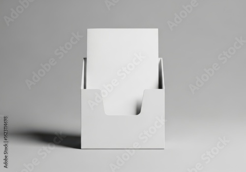 White brochure holder with blank paper on gray background image