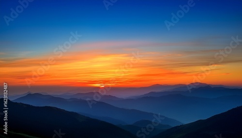 Wallpaper Mural sunset over the mountains with orange and blue hues Torontodigital.ca