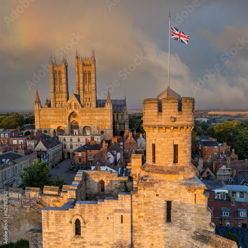 Lincoln Cathedral and Lincoln Castle historic landmark in England UK, medieval gothic architecture, city skyline, heritage site, tourism destination, golden hour light, iconic British cityscape